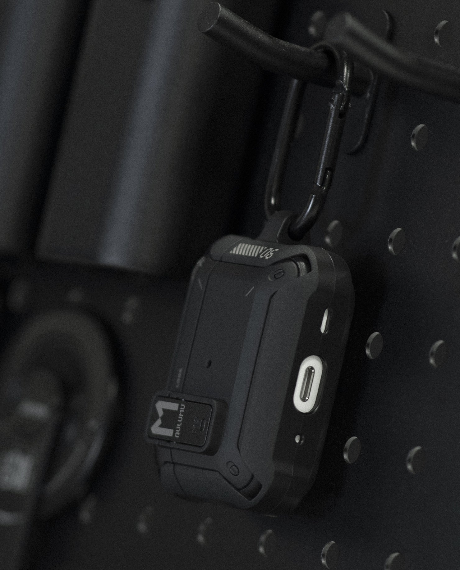 Close-up of AULUMU A19 AirPods Pro case highlighting secure locking clip and reinforced corner protection