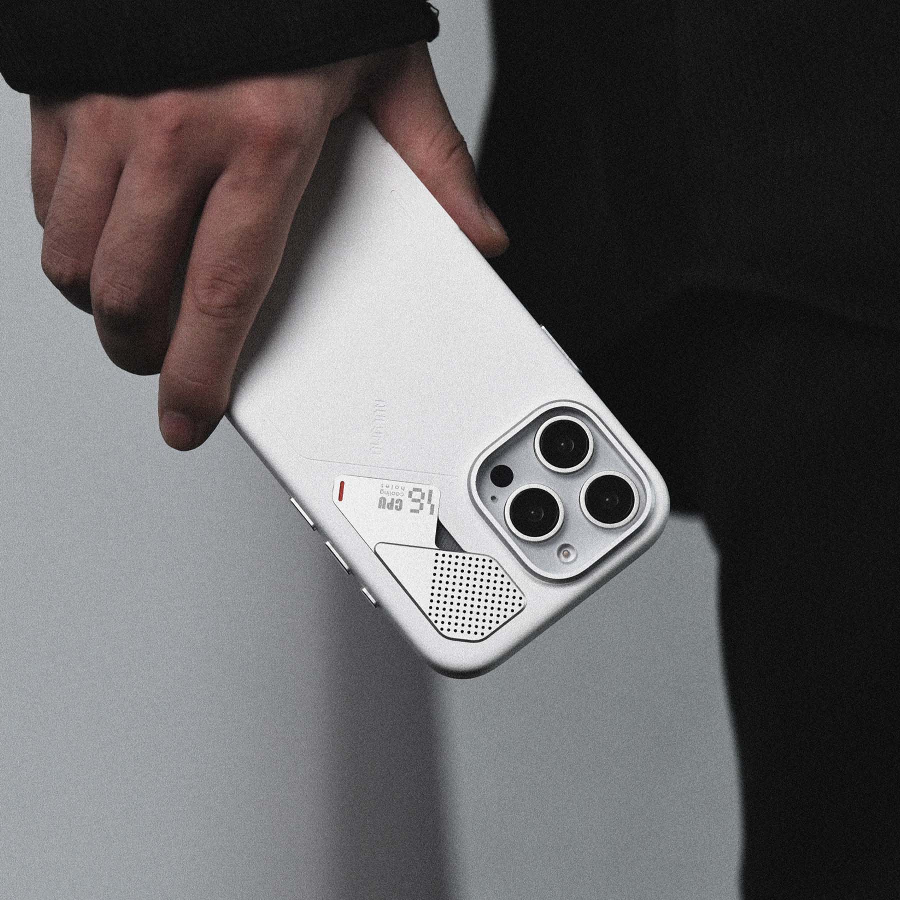 AULUMU A16 white vegan leather case for iPhone 16 Pro with real cooling back and raised camera control cover held in hand