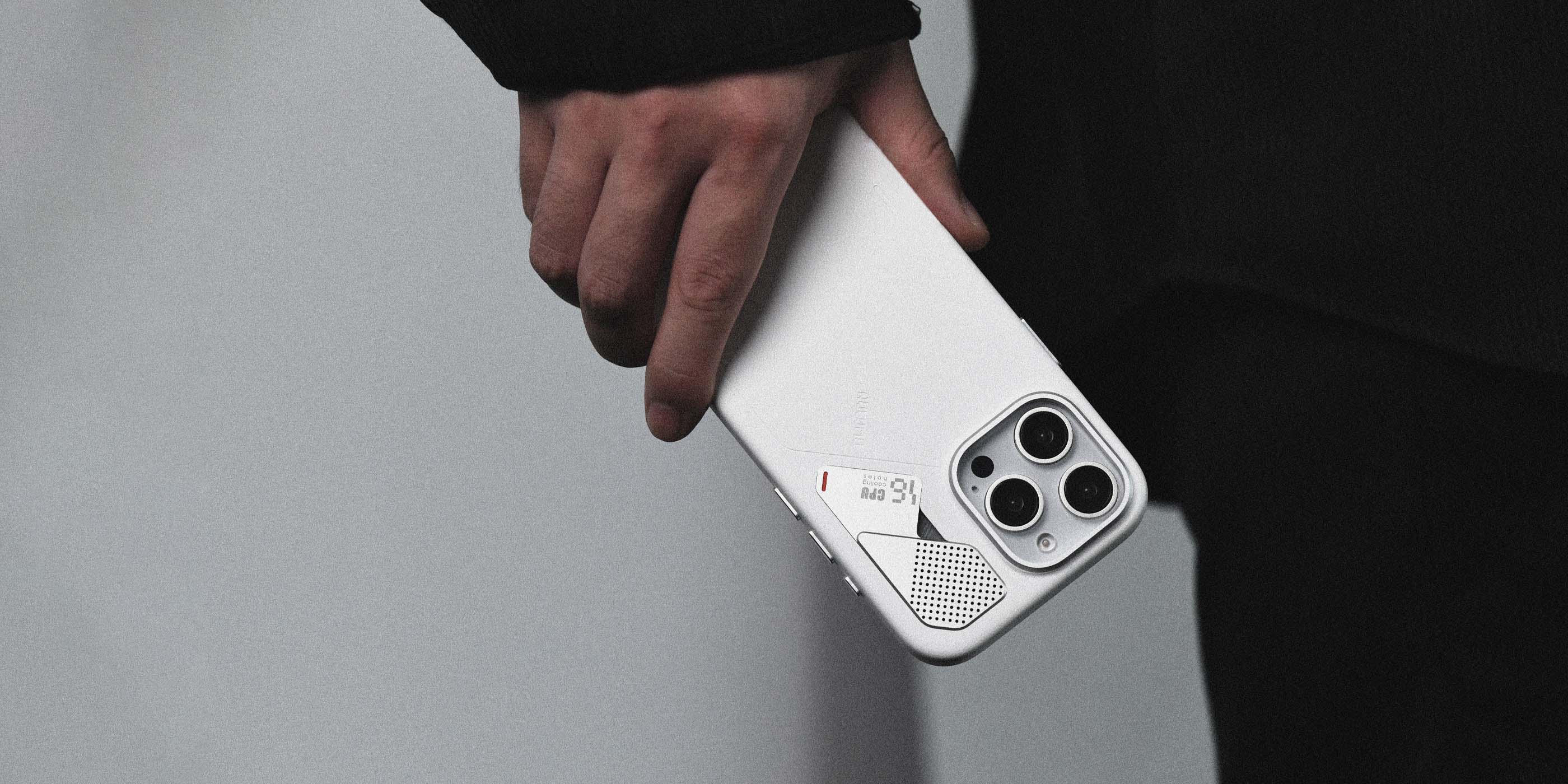 AULUMU A16 white vegan leather case for iPhone 16 Pro with real cooling back and raised camera control cover held in hand