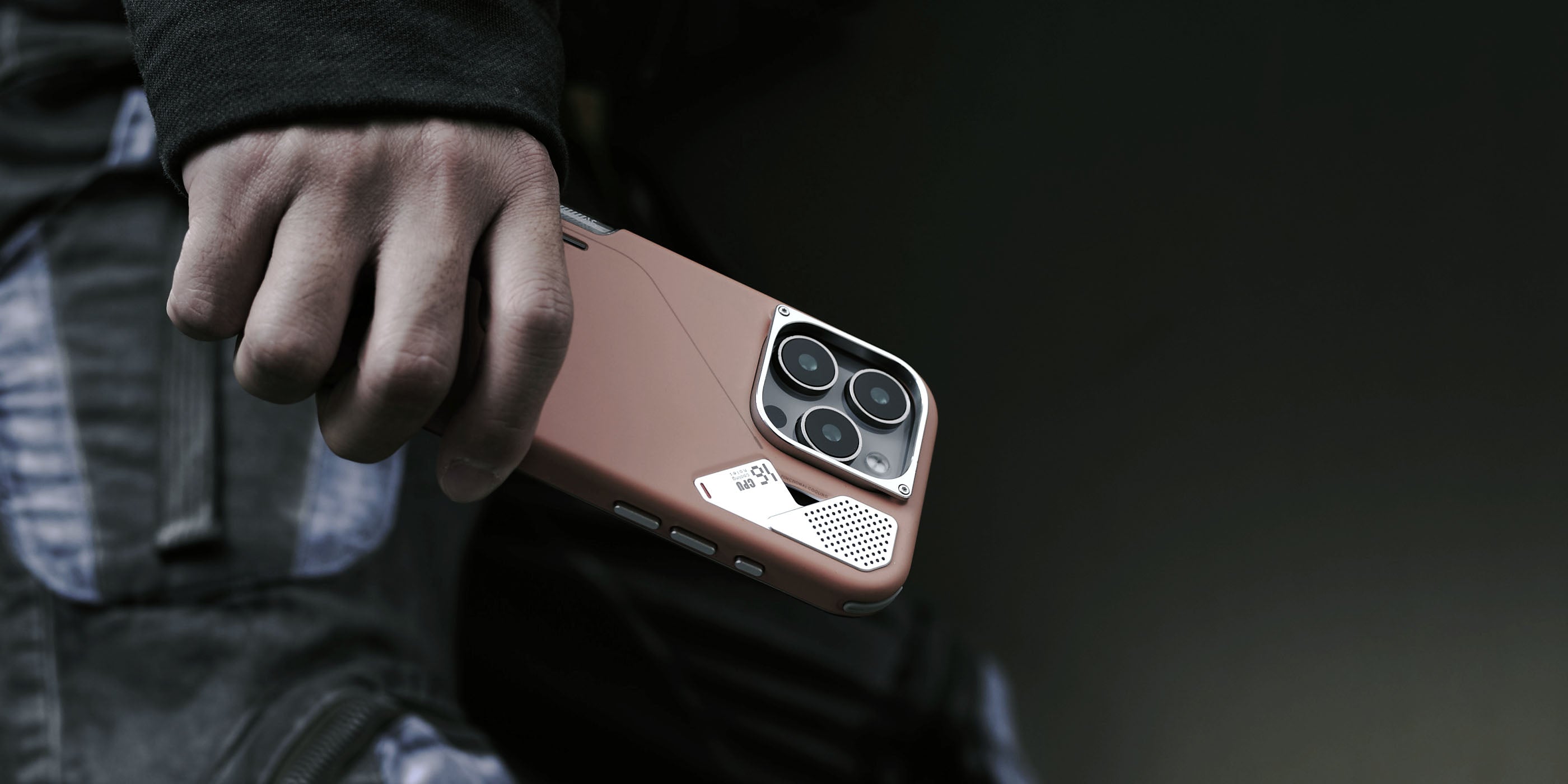 AULUMU A16 slim brown shockproof case for iPhone 16 Pro with real-cooling back and raised camera control cover held in hand outdoors