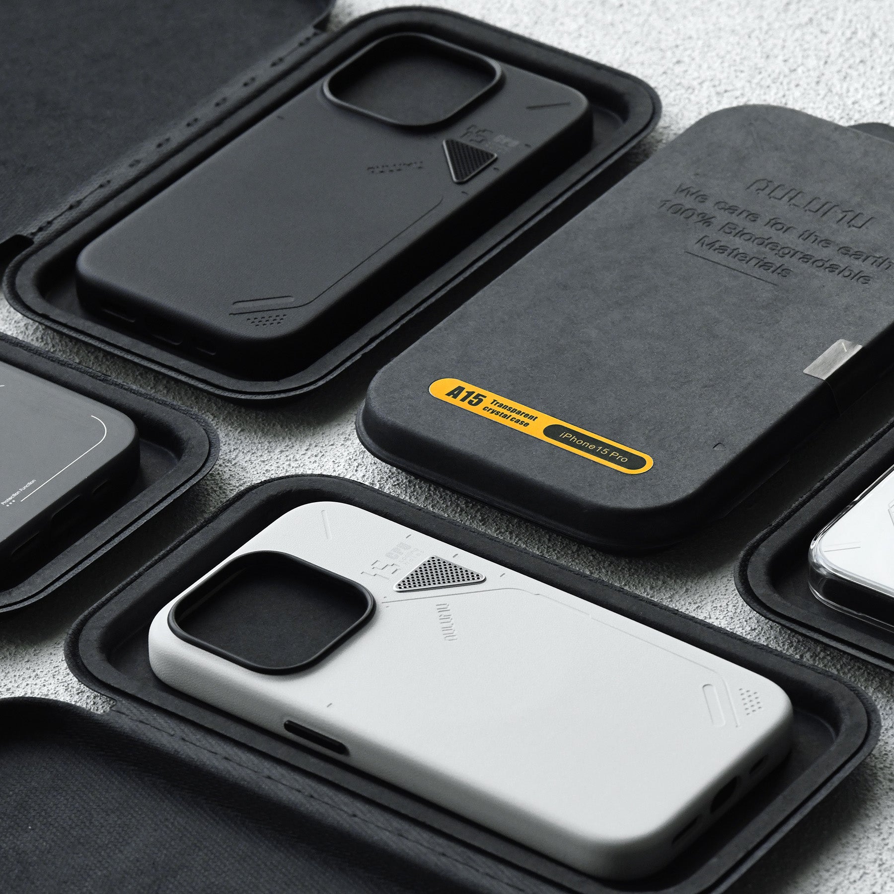 Close-up of AULUMU A05 iPhone case and biodegradable packaging tray highlighting sustainable design