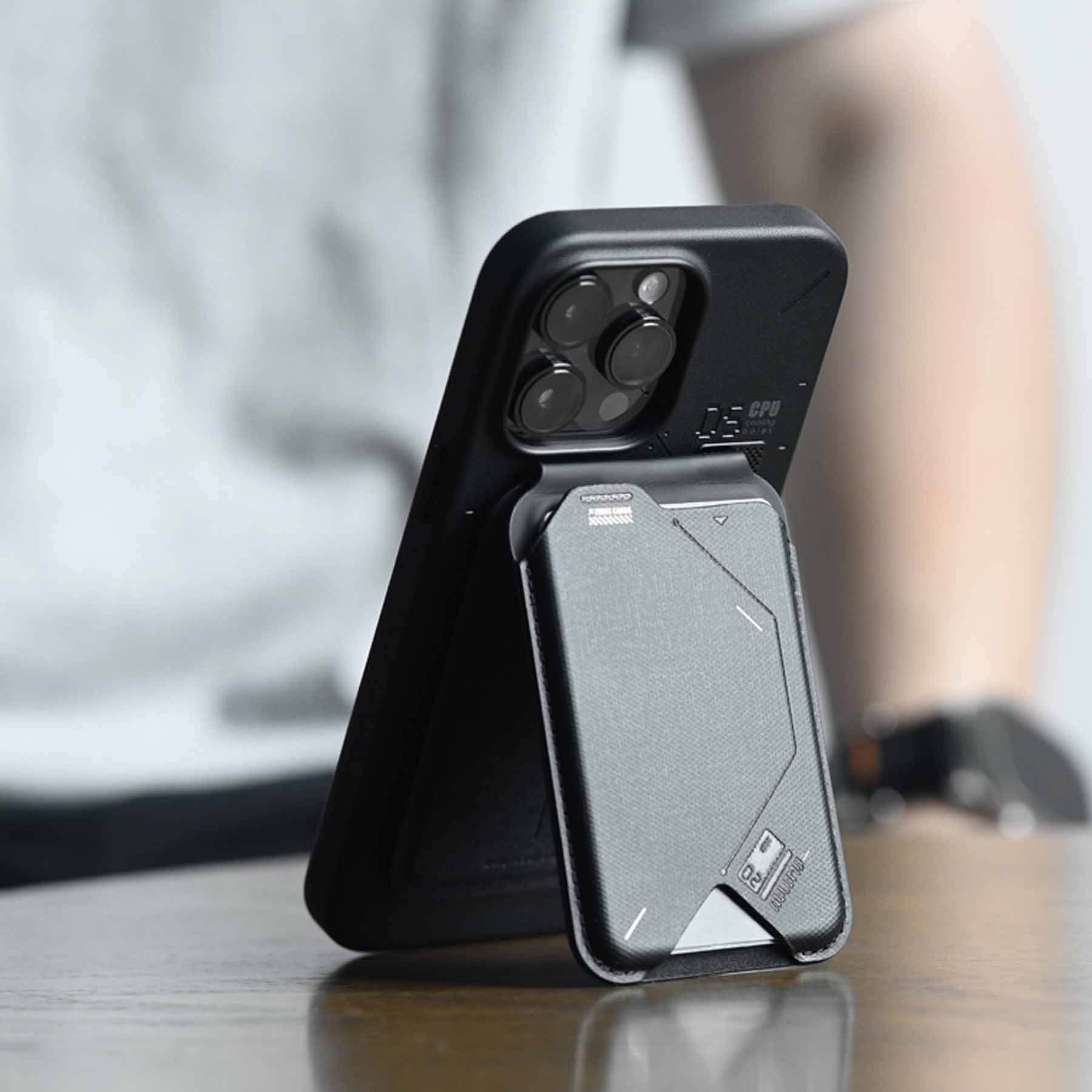 Close-up of AULUMU G02 Magnetic Flip Wallet used as a stand behind an iPhone.