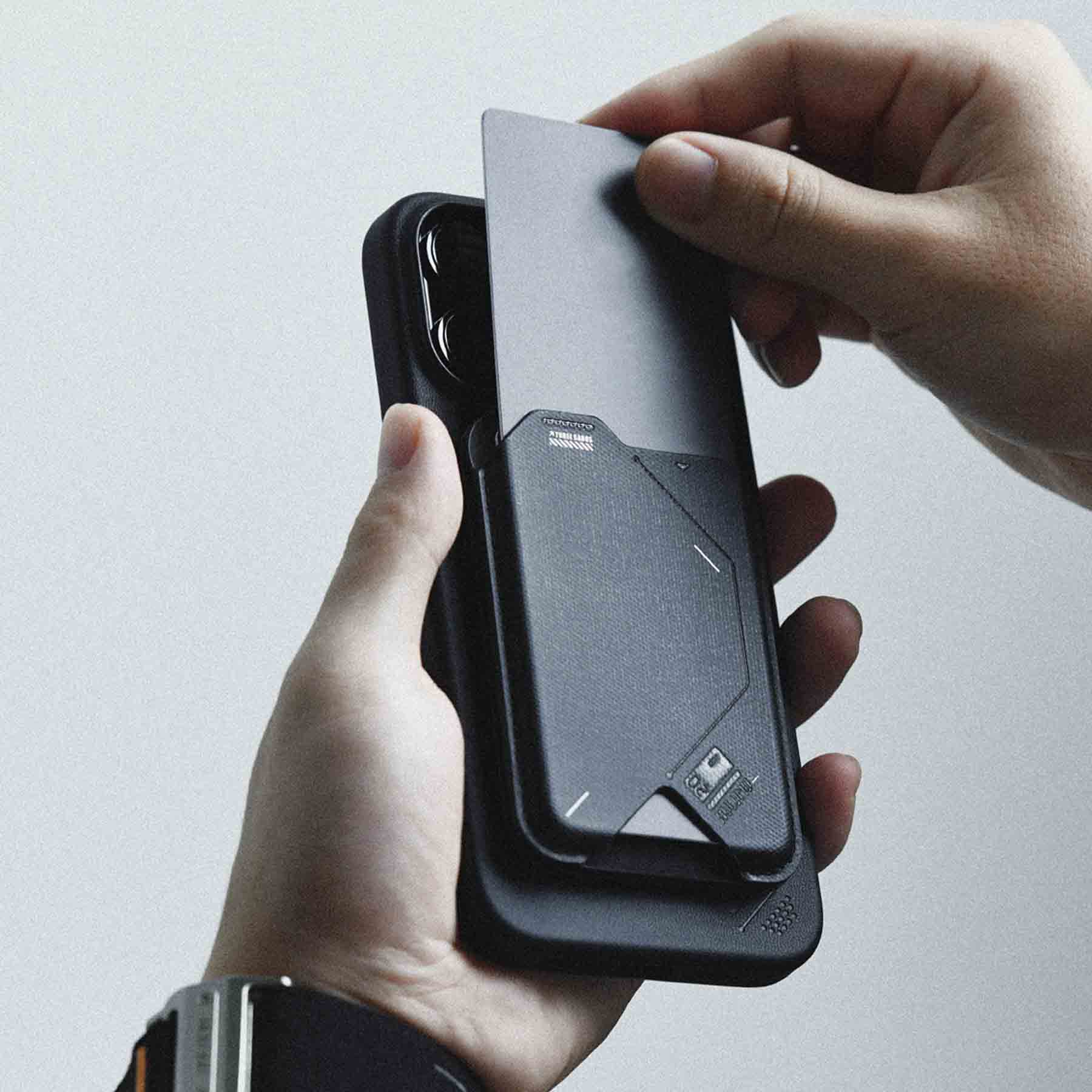 Close-up of AULUMU G02 Magnetic Flip Wallet on iPhone while a card is being inserted.